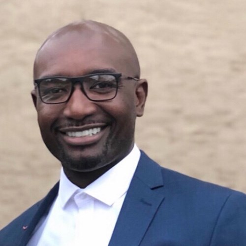 Headshot of NYRR Board of Directors member Travis Sampson