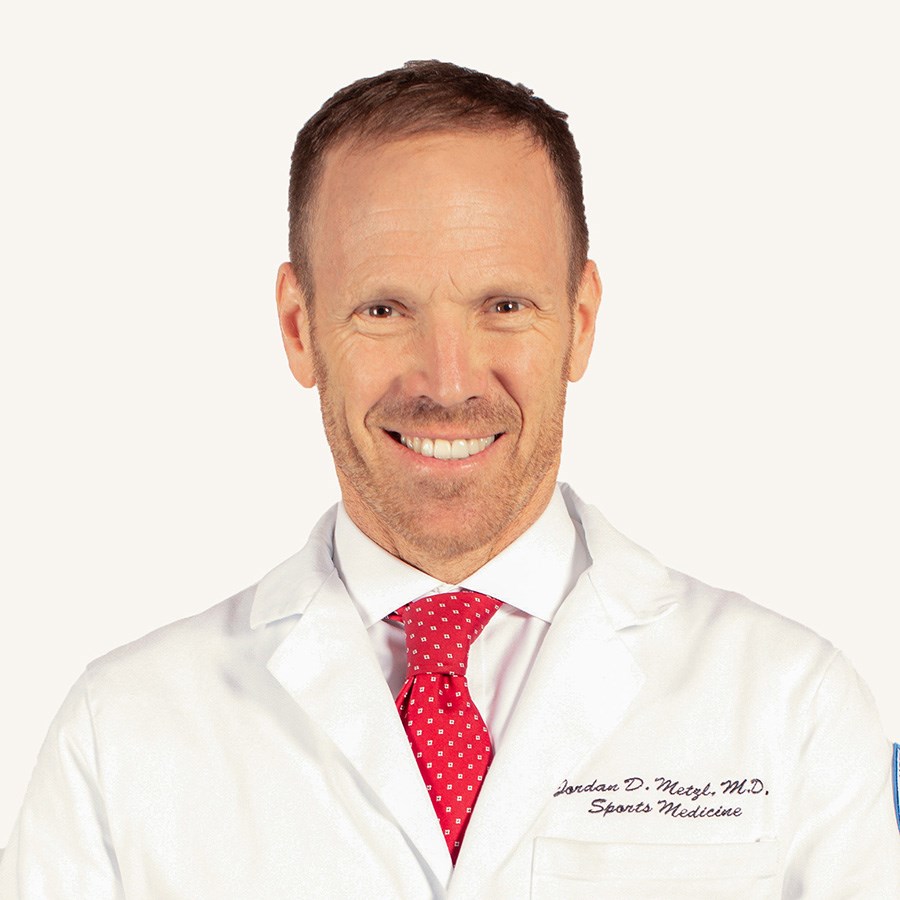 Headshot of NYRR Board of Directors member Jordan Metzl