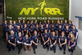 A group photo of Rising New York Road Runners participants and leaders with Ambassador Jenny Simpson. 