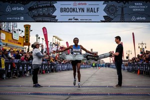 Runner winning the 2016 NYRR Popular Brooklyn Half Marathon