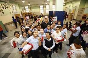 Rising New York Road Runners receiving New Balance sneakers