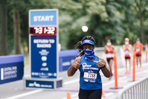 A woman running at NYRR's Return to Racing Project event