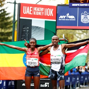 First place finishers Mathew Kimeli and Senbere Teferi pose with their nation's flags.