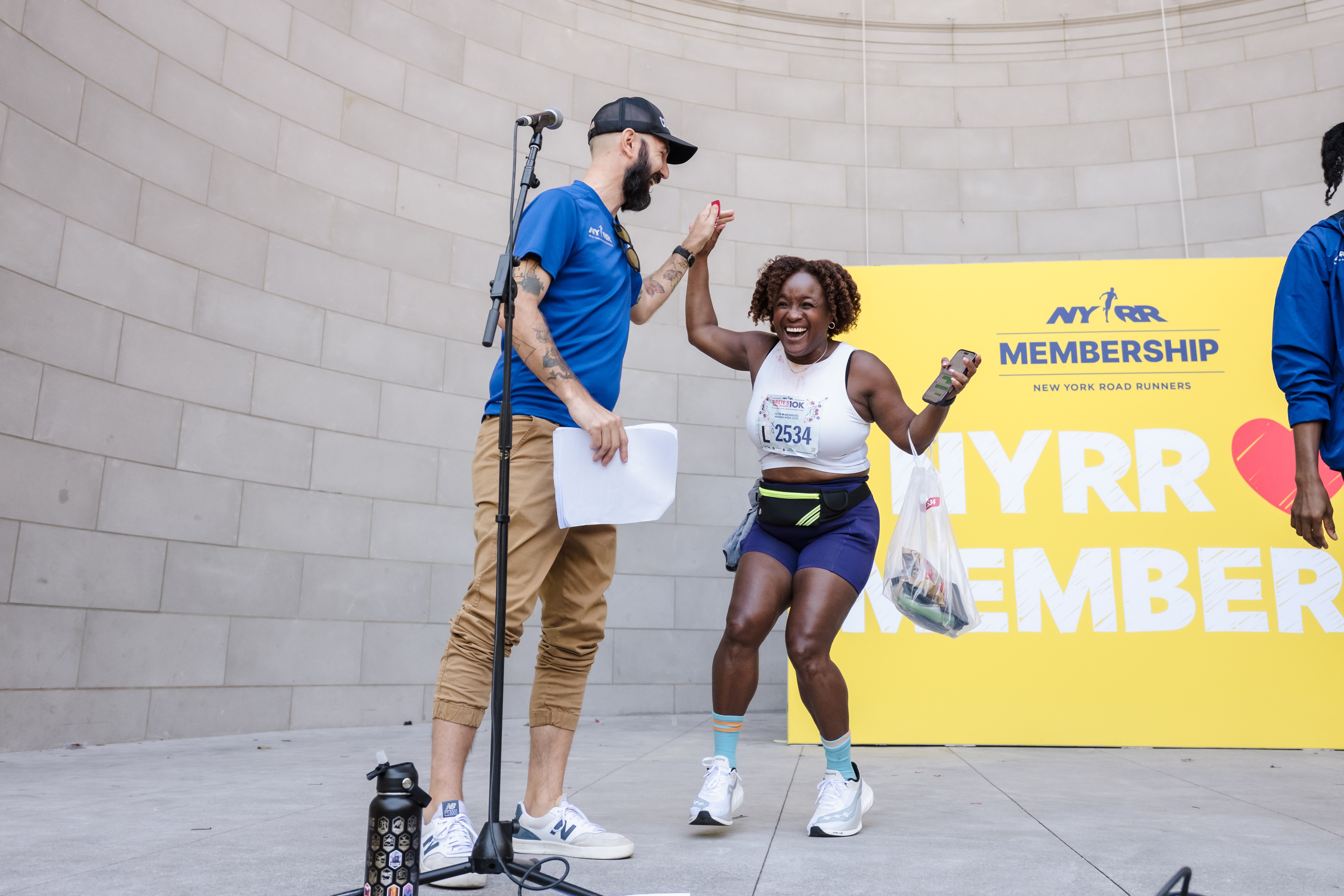 An NYRR member receiving a prize