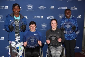 Belay Tilahun, Joyciline Jepkosgei, Daniel Romanchuk, and Tatyana McFadden, all four 2019 United Airlines NYC Half winners, pose with their awards. 
