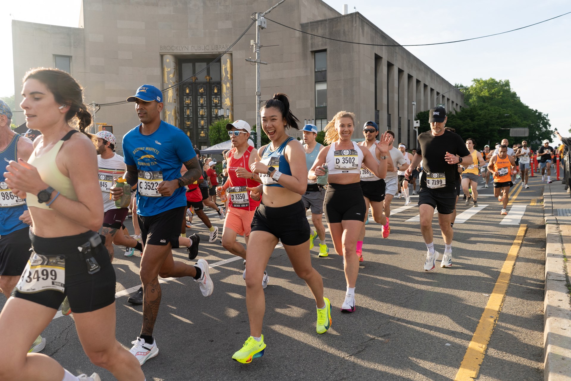 Runners run past the Brooklyn Library during the RBC Brooklyn Half