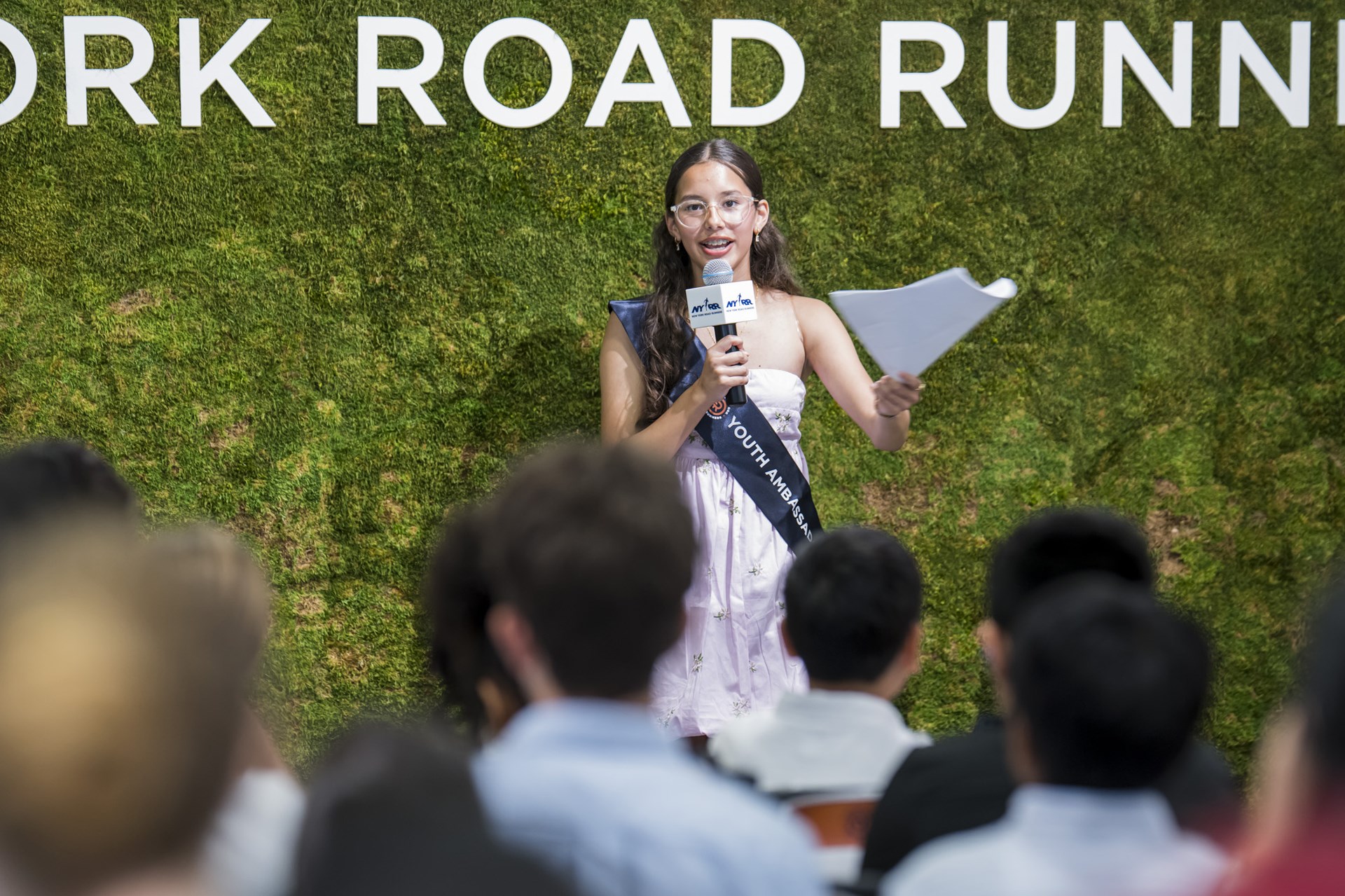 A youth ambassador giving a speech at graduation