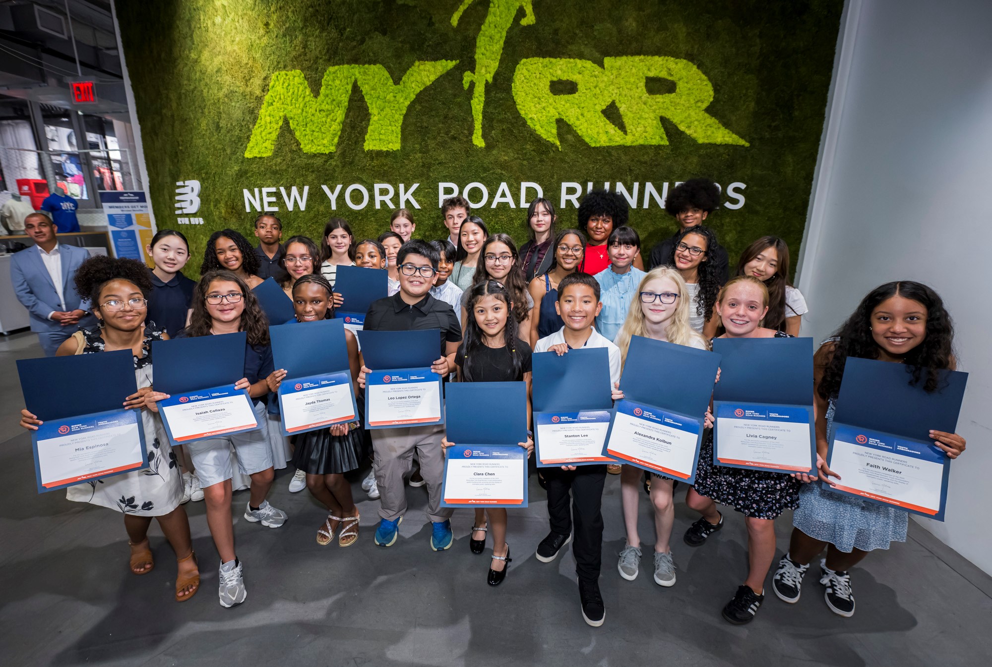 Youth ambassadors and their certificates at graduation