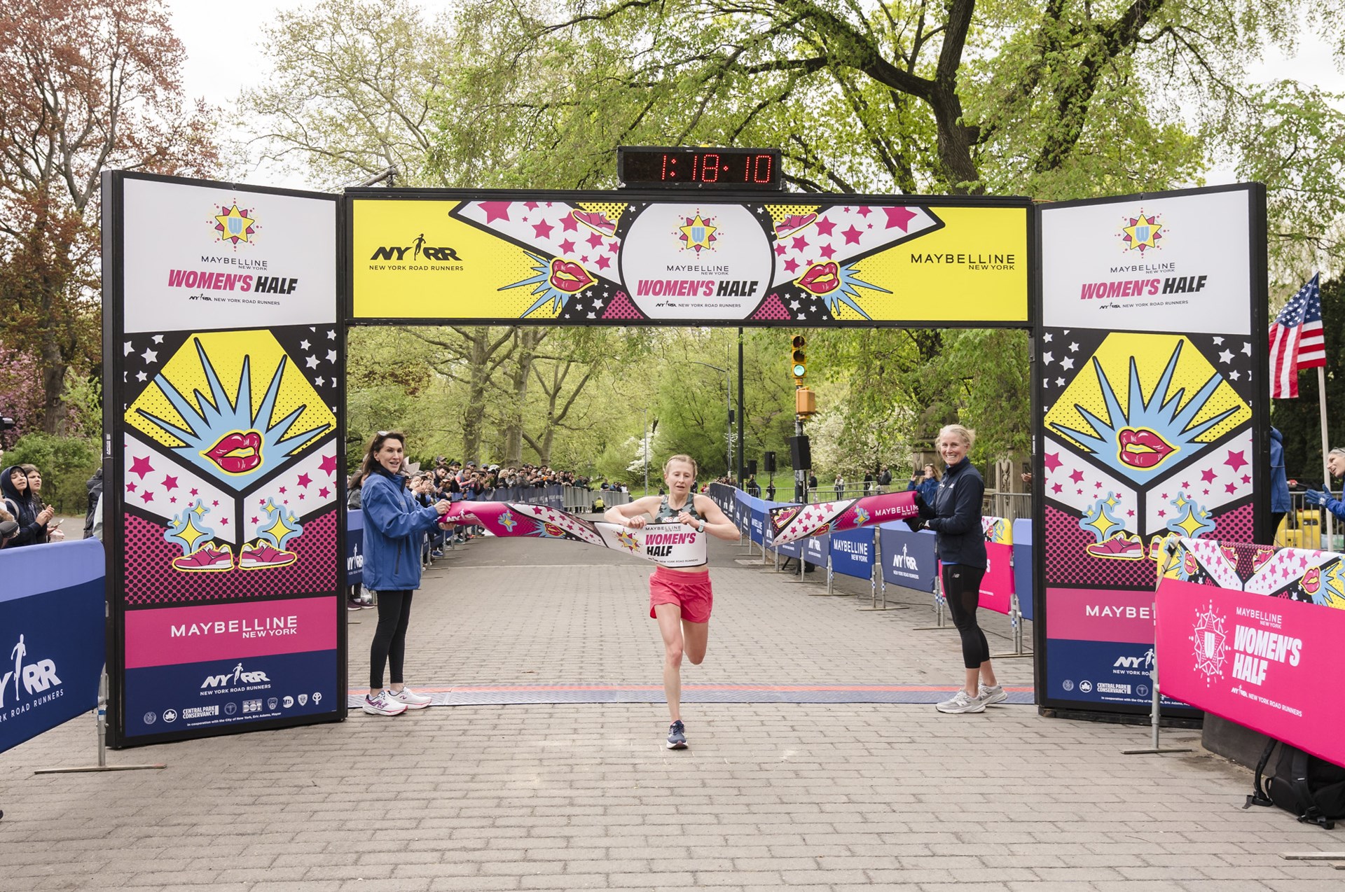 Runner breaks tape at the Maybelline Women's Half in Central Park