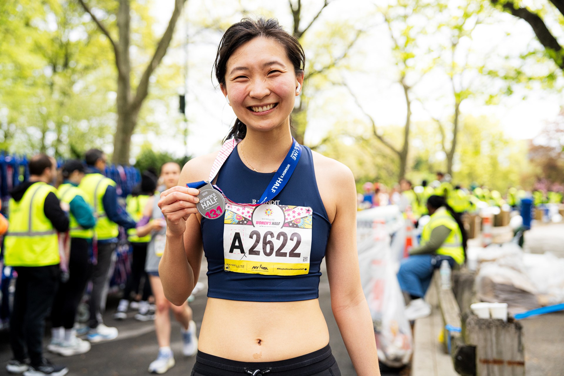 Runners cross the finish line at the Maybelline Women's Half in Central Park