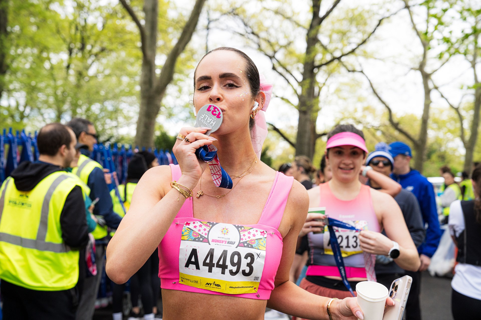 Runners cross the finish line at the Maybelline Women's Half in Central Park