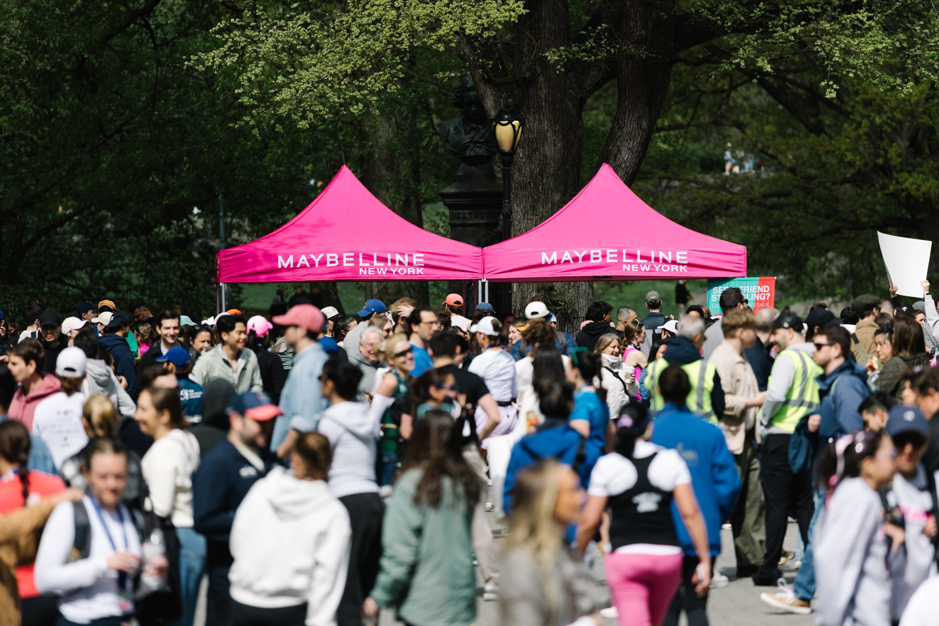 Runners cross the finish line at the Maybelline Women's Half in Central Park
