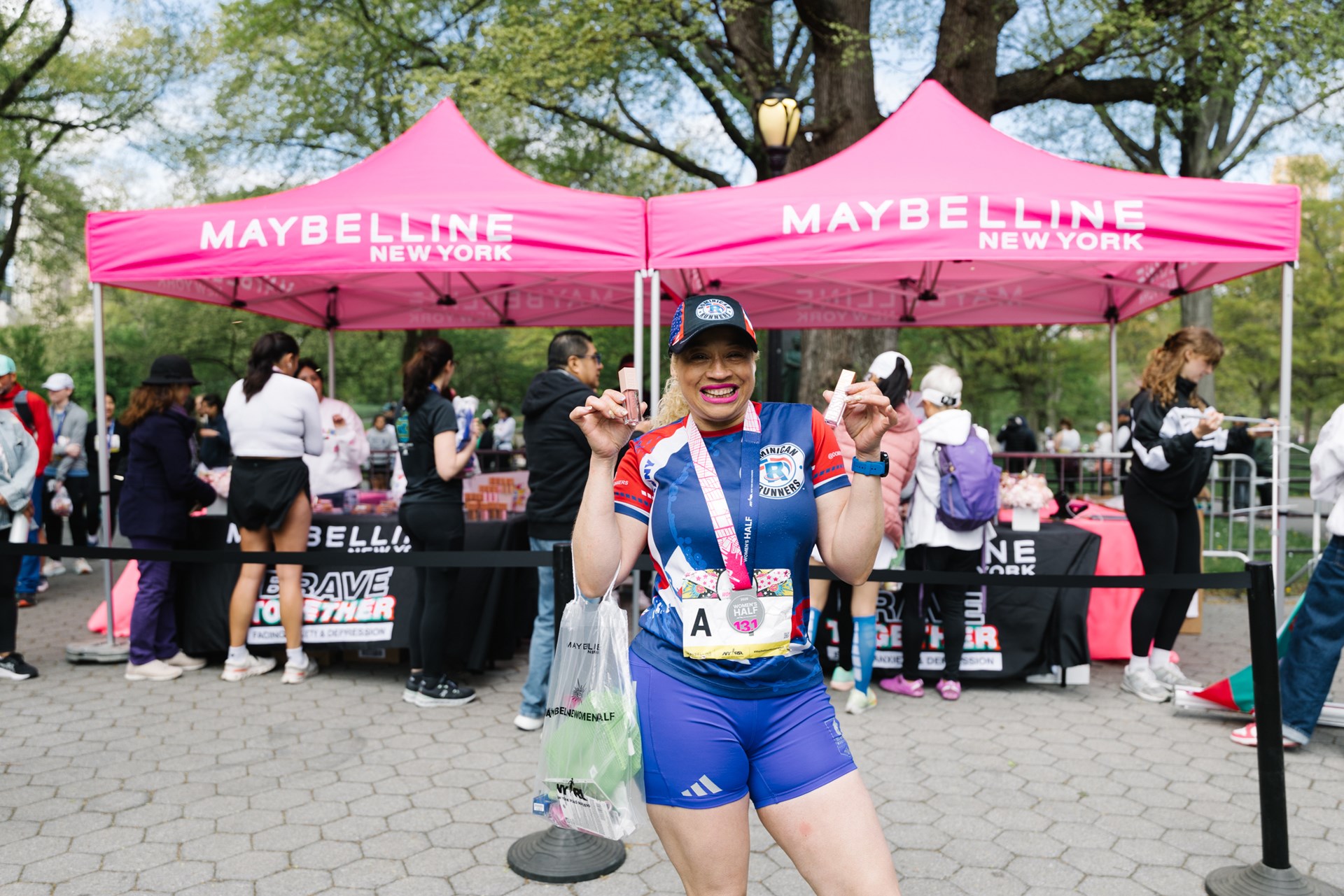 Runners cross the finish line at the Maybelline Women's Half in Central Park