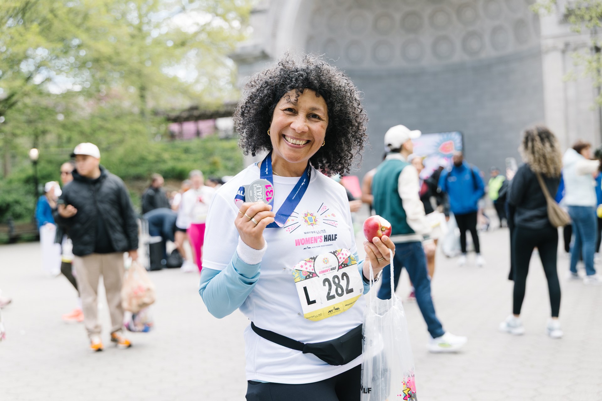 Runners cross the finish line at the Maybelline Women's Half in Central Park