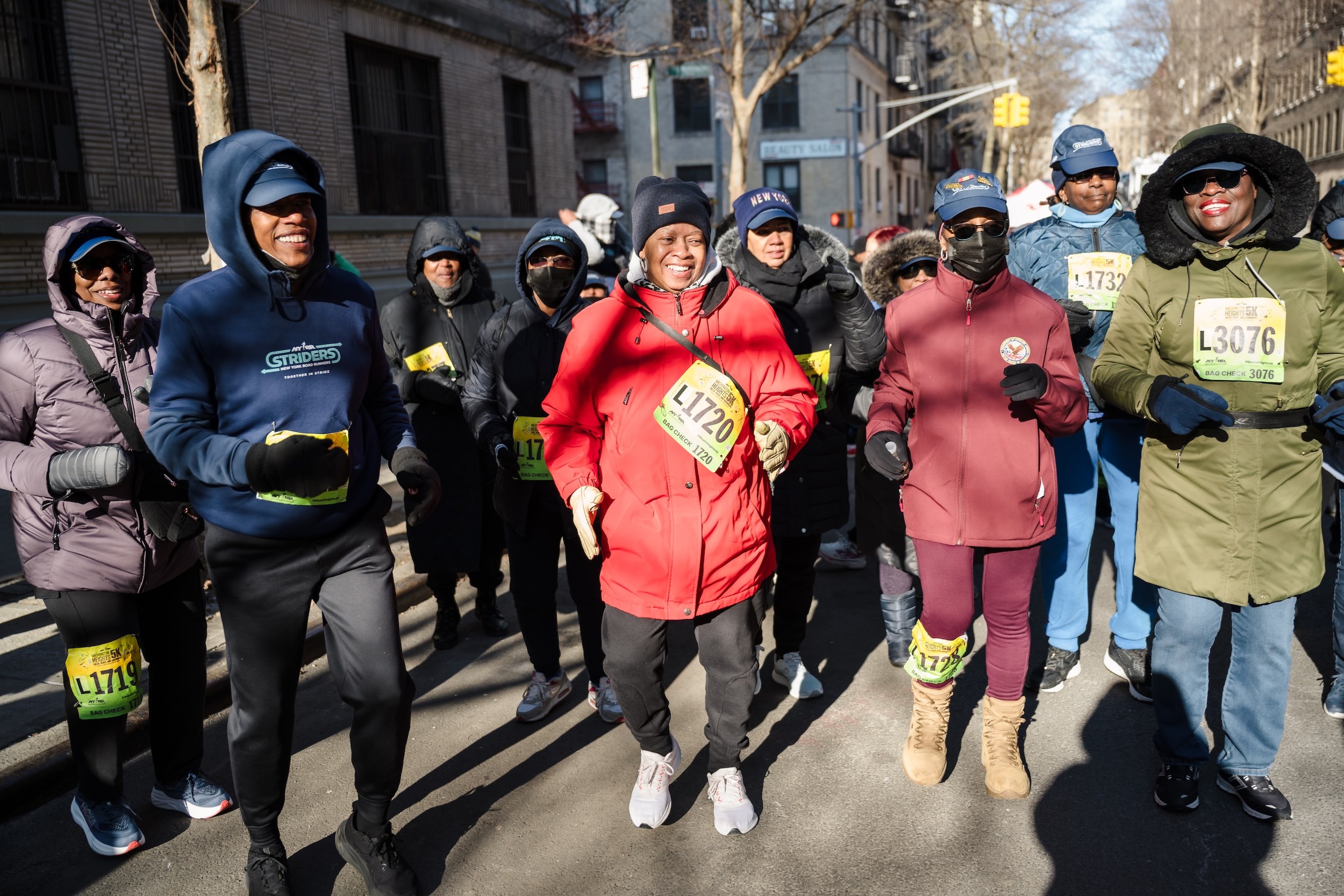 Striders warming up on the streets of Washington Heights