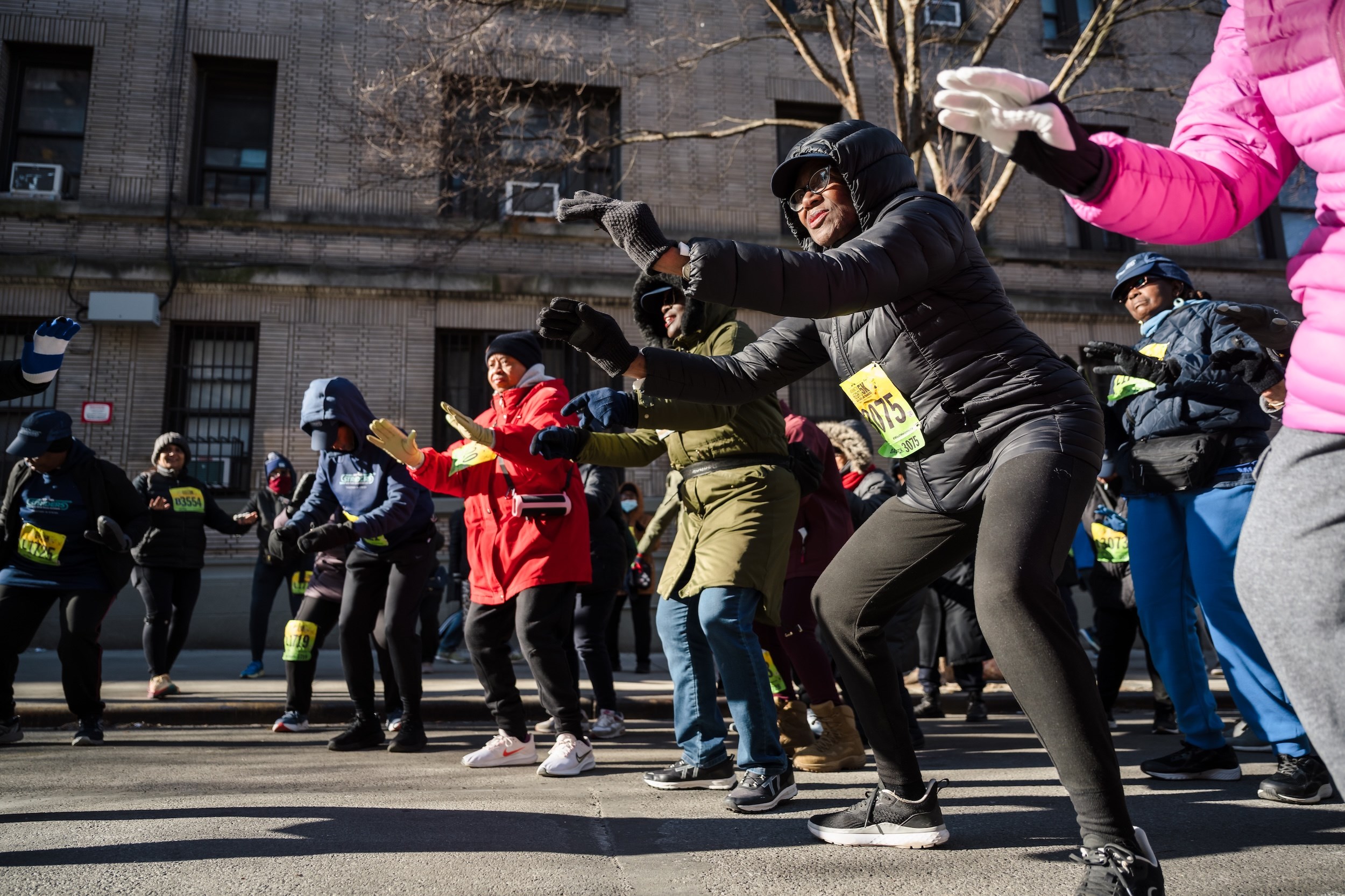 Striders warming up on the streets of Washington Heights
