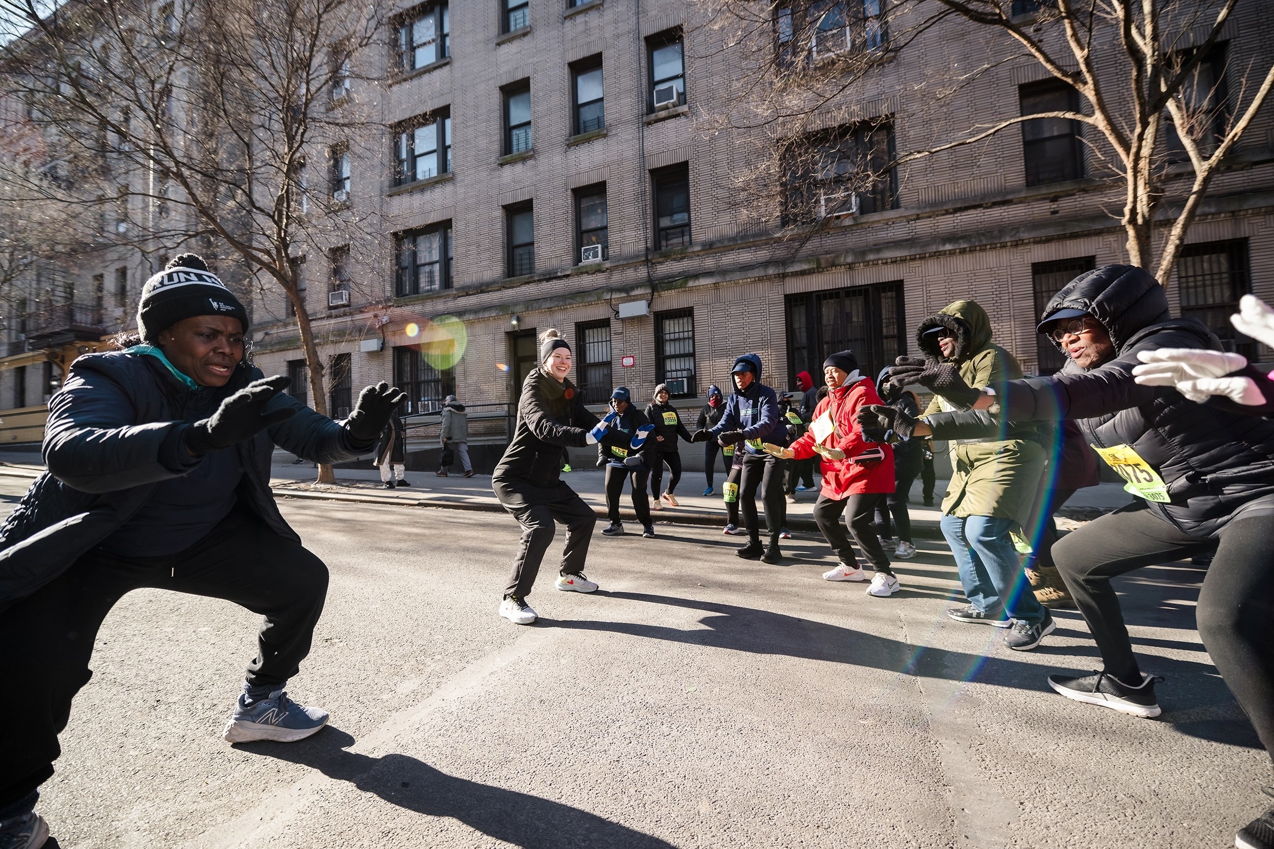 Striders warming up on the streets of Washington Heights