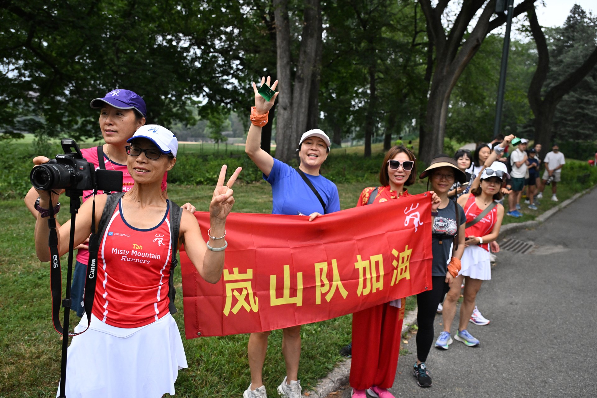 Group shot with sign
