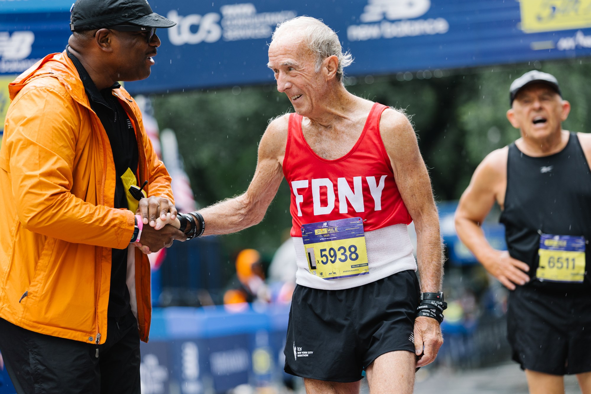 Gary Muhrcke at the New Balance 5th Avenue Mile finish line with Ted Metellus
