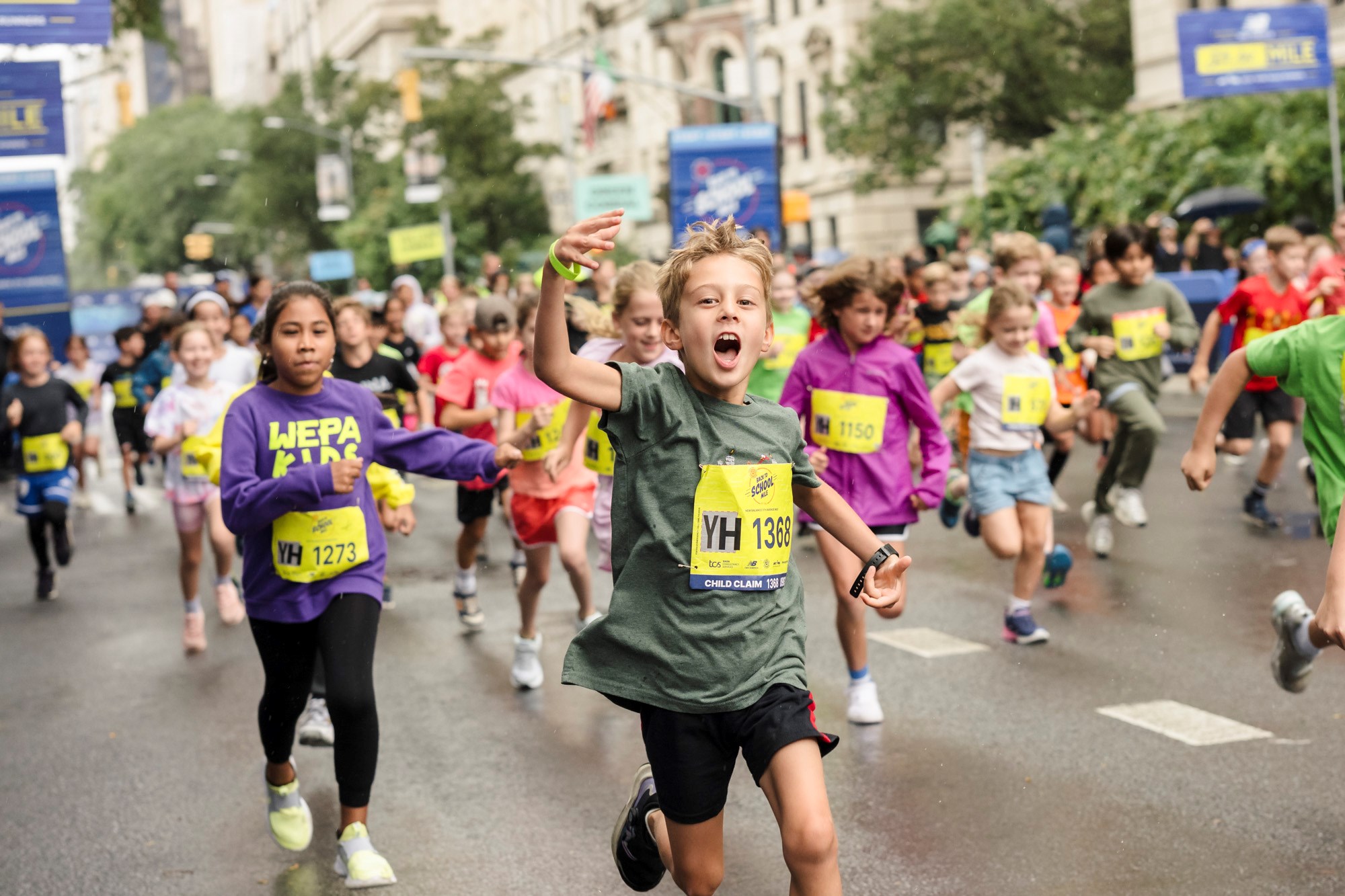 Kids running the Back to School Mile at the New Balance 5th Avenue Mile