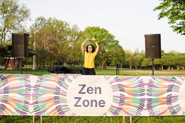 Kristina Lopez leads meditation at the Zen Zone at the NYRR Mindful 5K in Queens. 