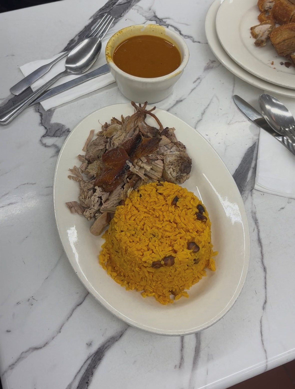 Pernil with rice and beans at 188 Cuchifritos in the Bronx.