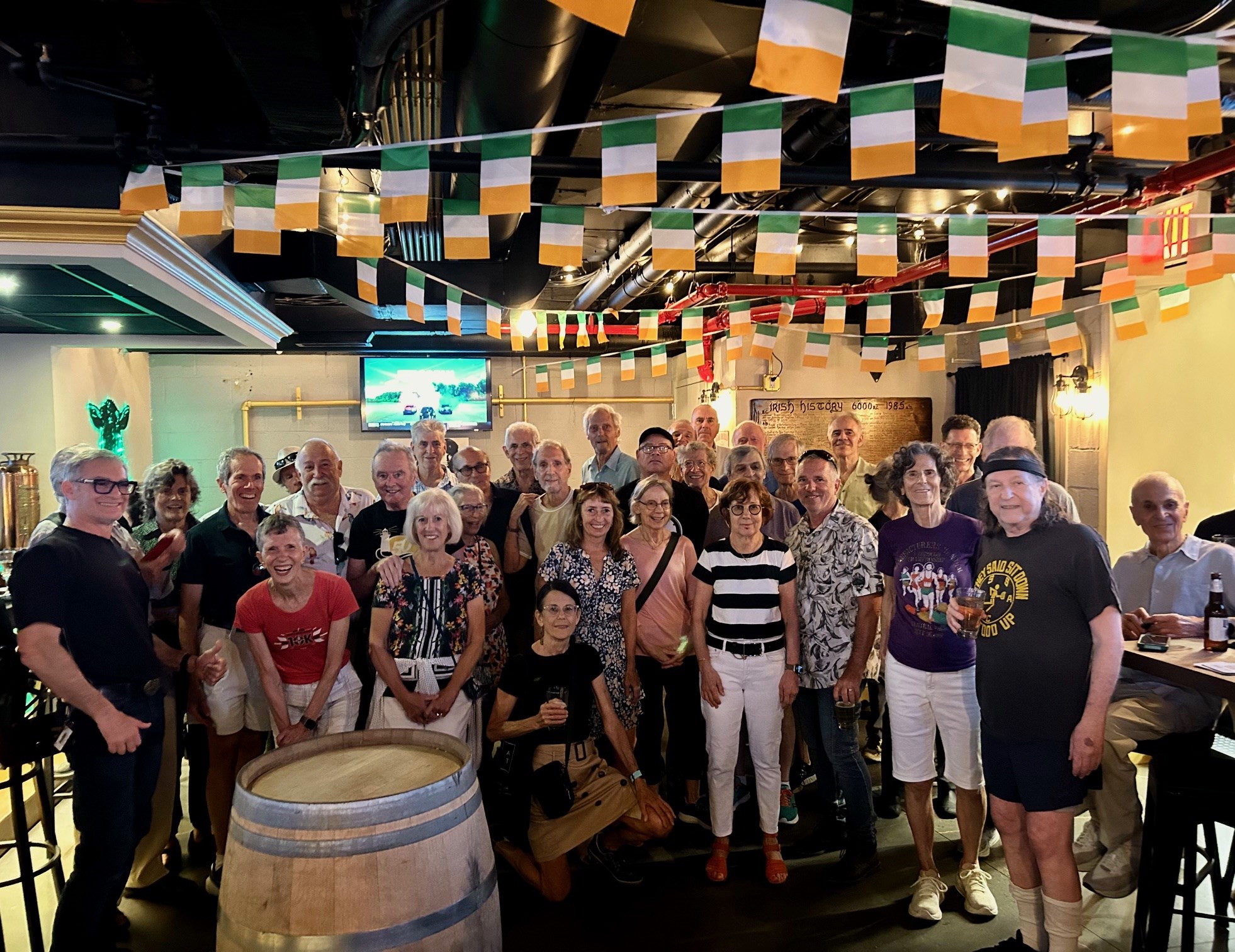 A large group of older runners gathered at an Irish bar in Manhattan in September 2025.