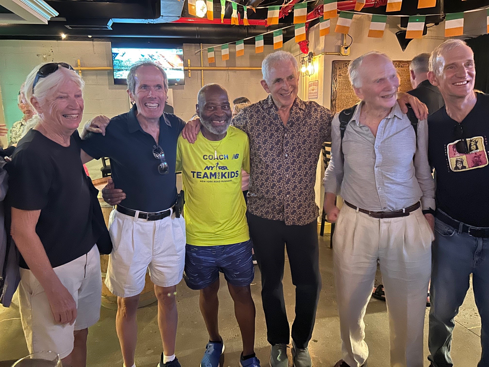 Six older runners at a bar in Manhattan in September 2025.