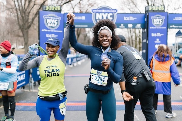 Shaunta-Mae Alexander crosses the finish line at the United Airlines NYC Half. 