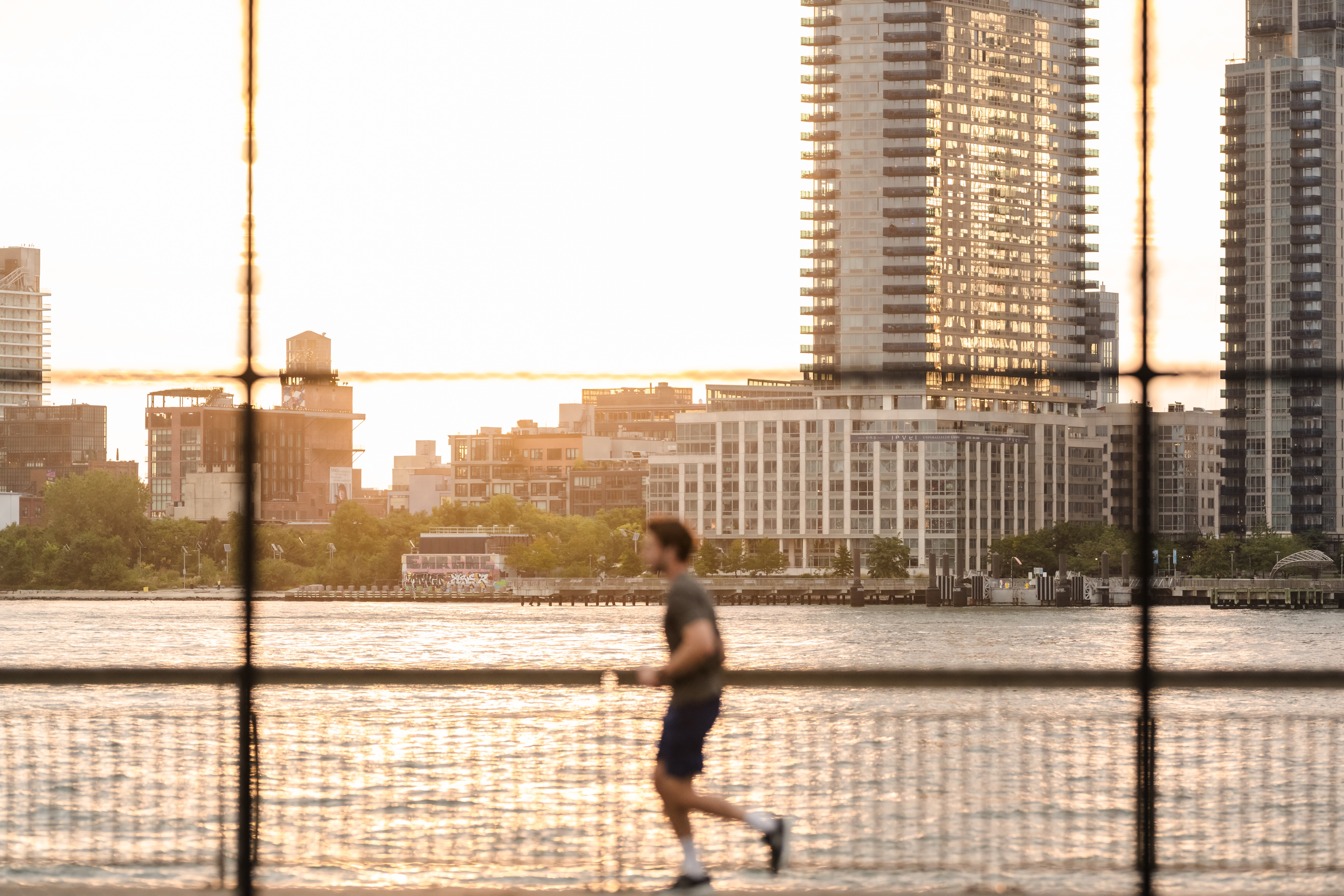 A runner from a distance at the East River Track in Manhattan in 2024