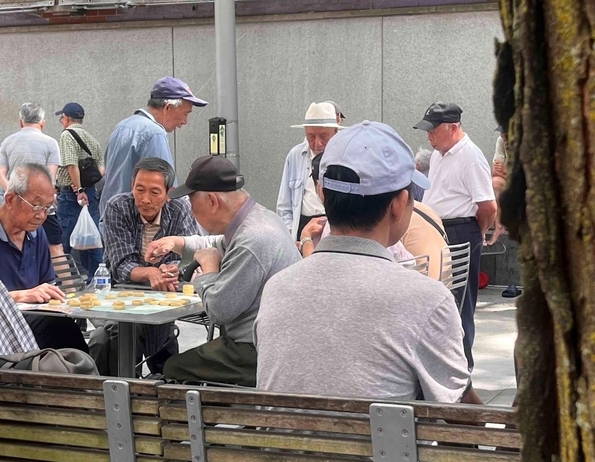 Men playing Chinese chess in Boston