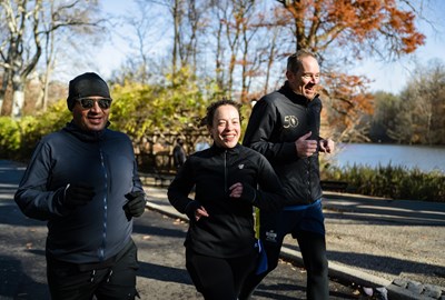 Three runners on West Drive in Central Park in winter 2025