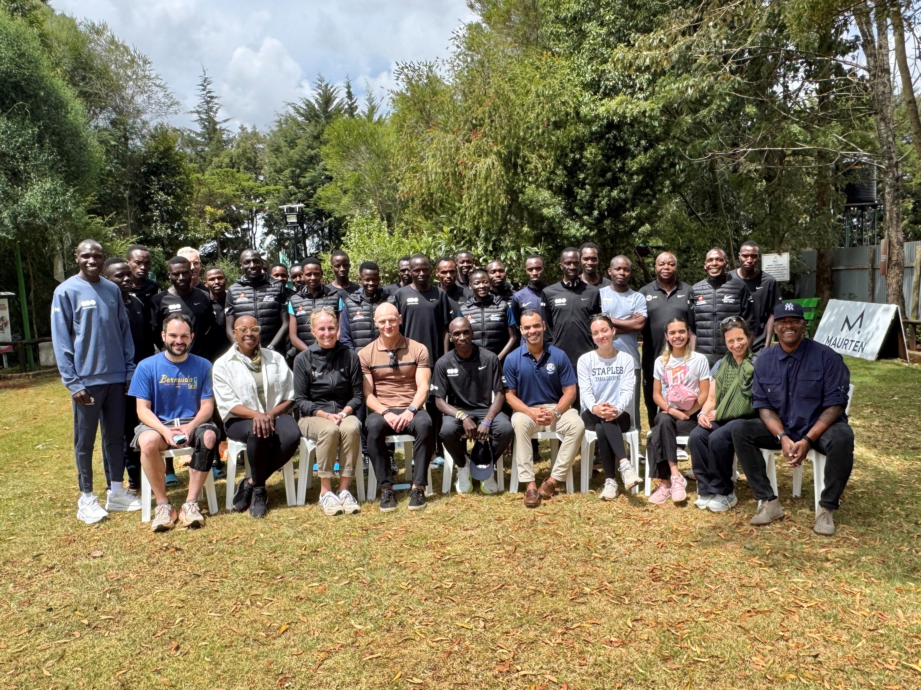 NYRR delegation to Kenya at the Global Sports Communication Training Facility with Eliud Kipchoge, Geoffrey Kamworwor, and other members of the dsm-firmenich Running Team, February 2026.