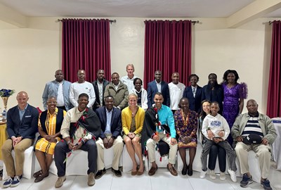 Members of NYRR's Executive Leadership and Professional Athletes Team with Toby Tanser and past Kenyan New York City Marathon champions in February 2026.
