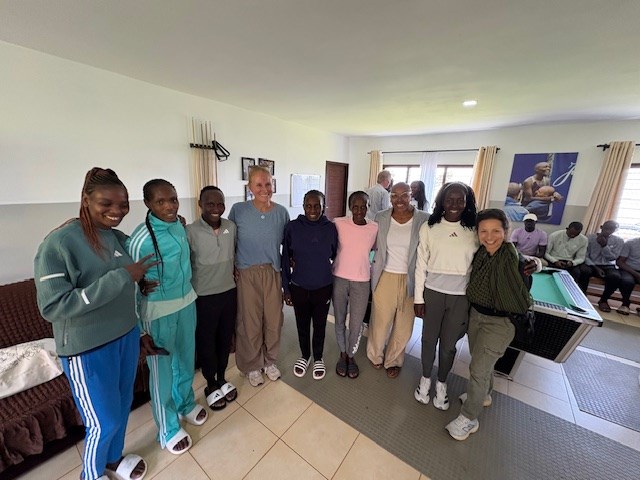 Christine Burke, Erica Edwards O'Neal, and Dorian Kail of NYRR with the female athletes of 2RunningClub, Kenya, February 2026.
