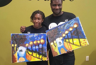 Kevin and Jasmine with artwork