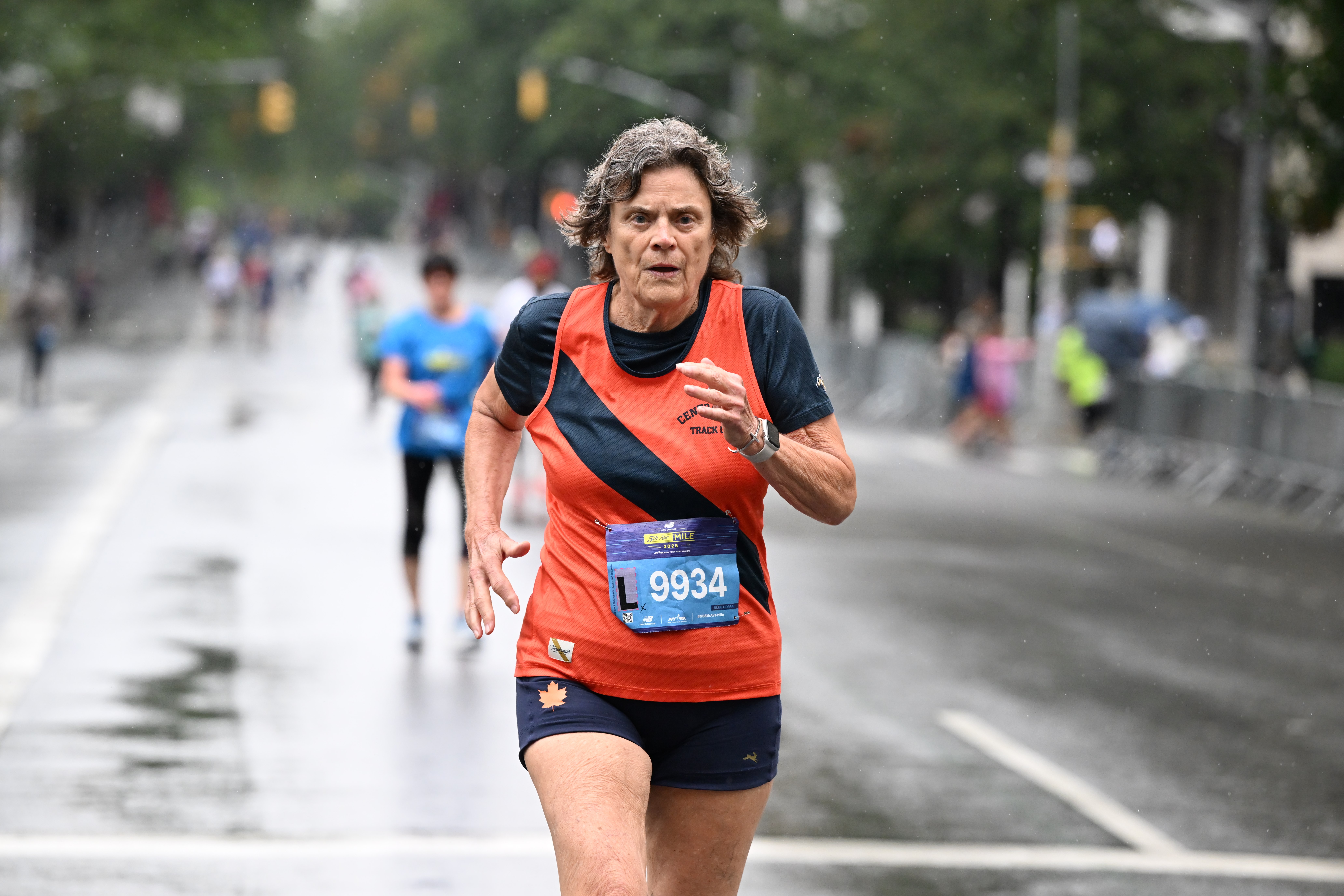 Lynn Blackstone running the 2025 New Balance 5th Avenue Mile in the rain.