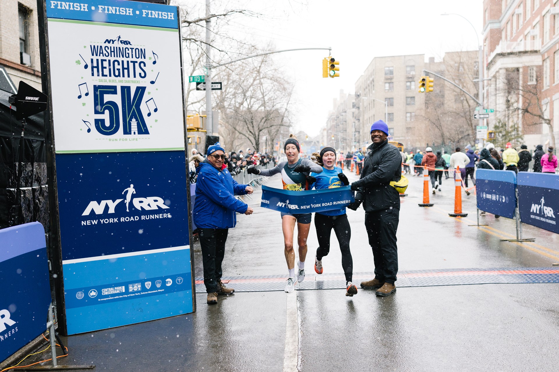 Roberta Groner breaking the tape at 2026 Washington Heights 5K