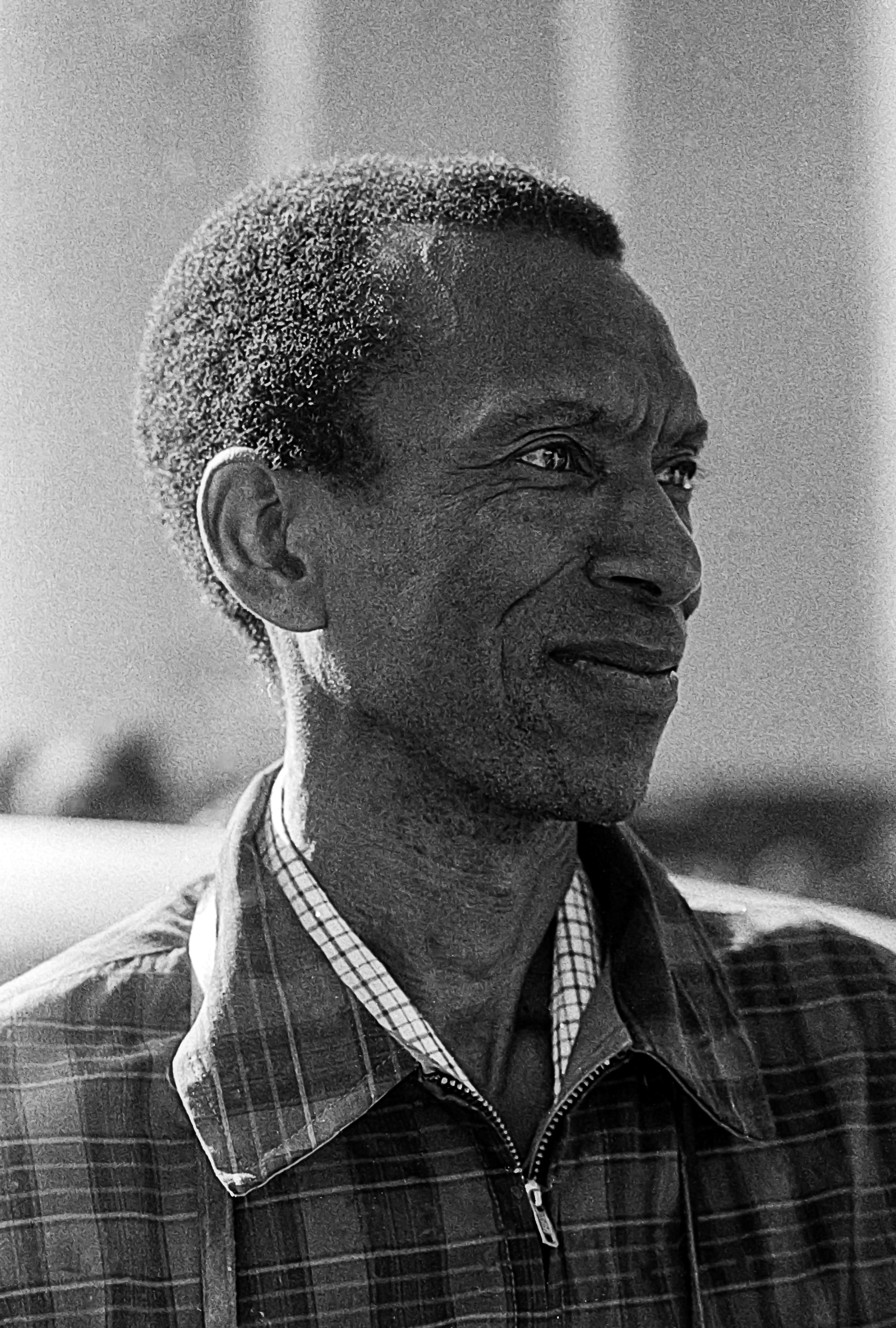 Ted Corbitt head shot black and white looking to right.