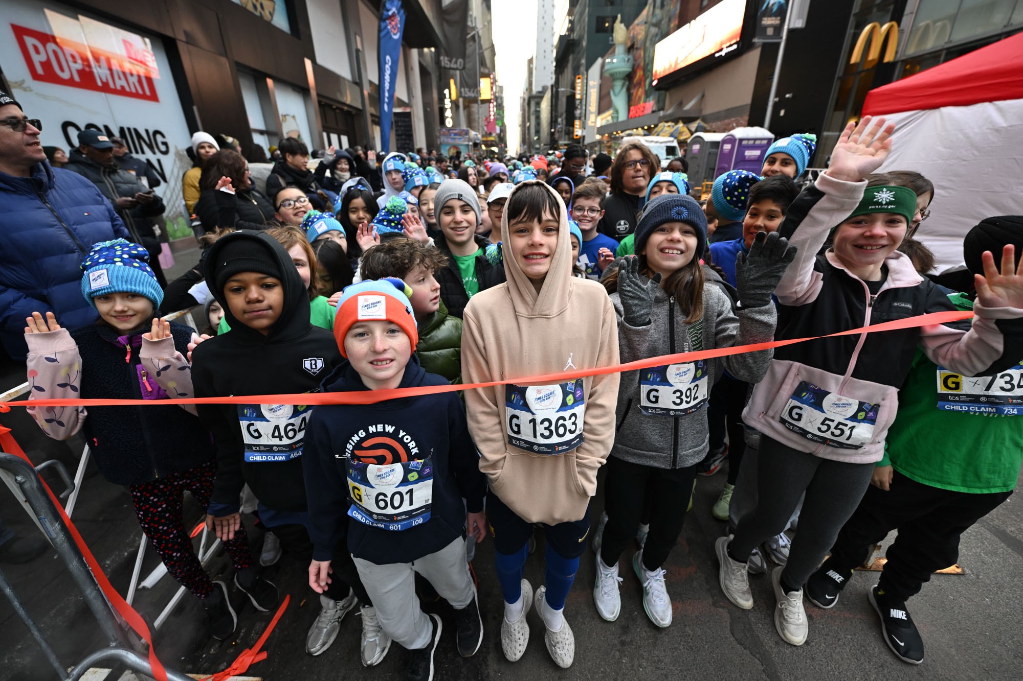 Group of children before start of 2026 Times Square Kids Run at the United Airlines NYC Half