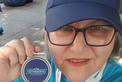 Strider Donna Nerges close up with Striders medal in 2026